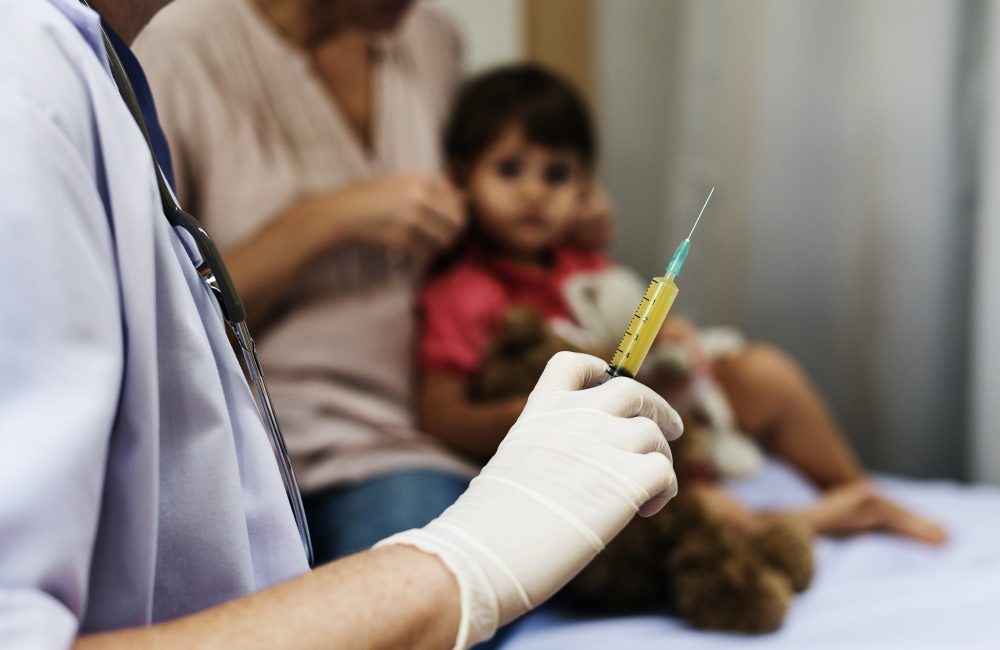 doctor-is-preparing-syringe-shot-min
